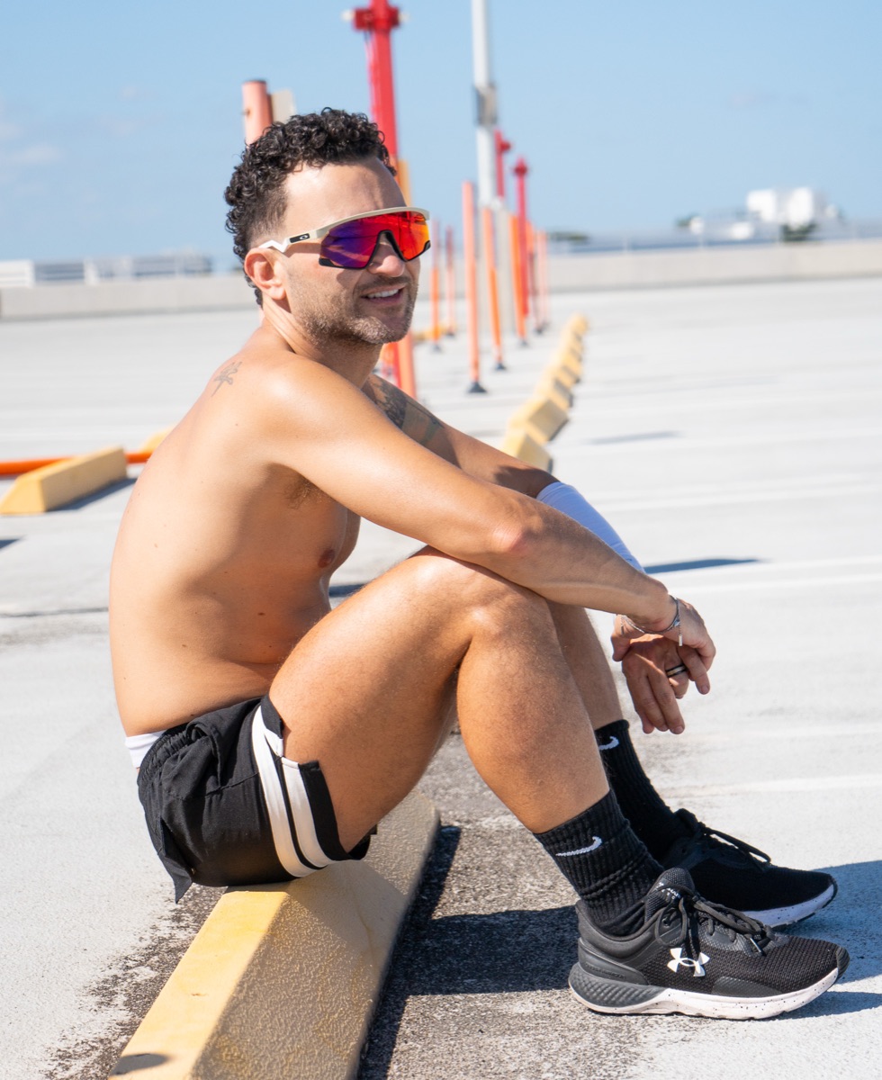 A pickleball player taking a break courtside in the Miami sunshine